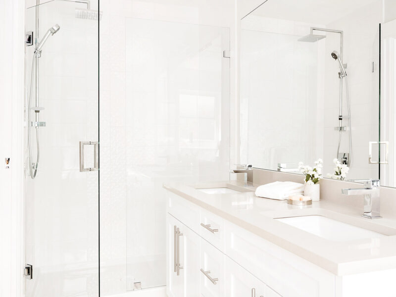 Quietly luxurious bathroom, elegant en-suite bathroom, soothing grey accents, large walk-in modern shower, sleek porcelain tiles, Maxine Whitehead design