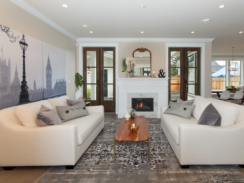 clean lines in modern living room, classic mix with natural materials, settle into deep sofas, soft patterned rug underfoot, french doors lead to a shady private garden, Maxine Whitehead design