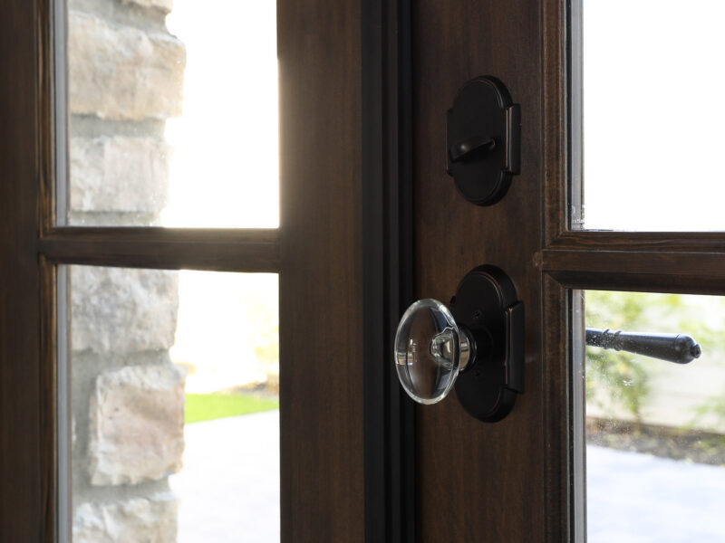 French doors to shady private garden, bespoke door hardware, old world stone style adds warmth and sophistication, Maxine Whitehead design