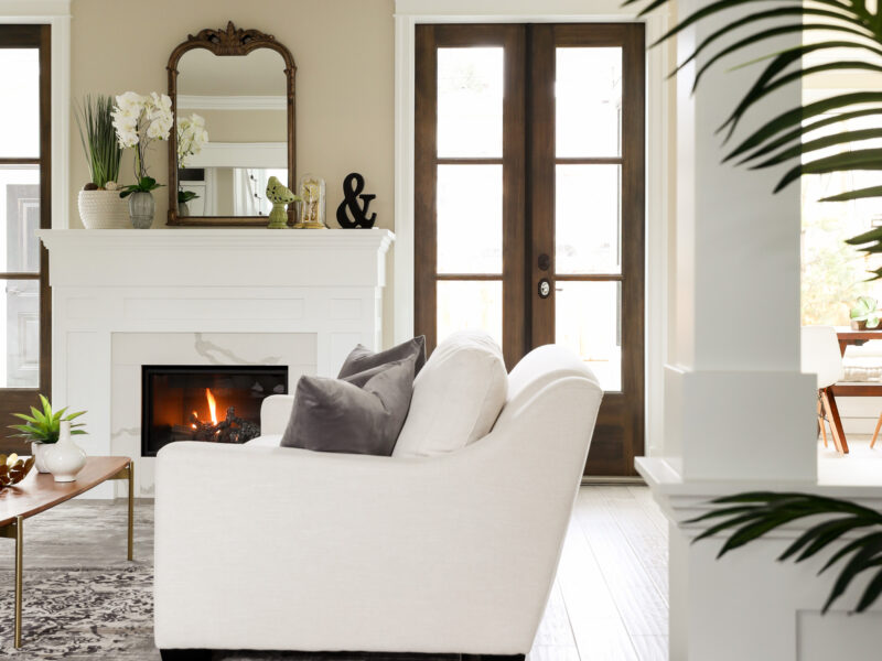 clean lines in modern living room, classic mix with natural materials , soft rug underfoot, french doors lead to a shady private garden, Maxine Whitehead design