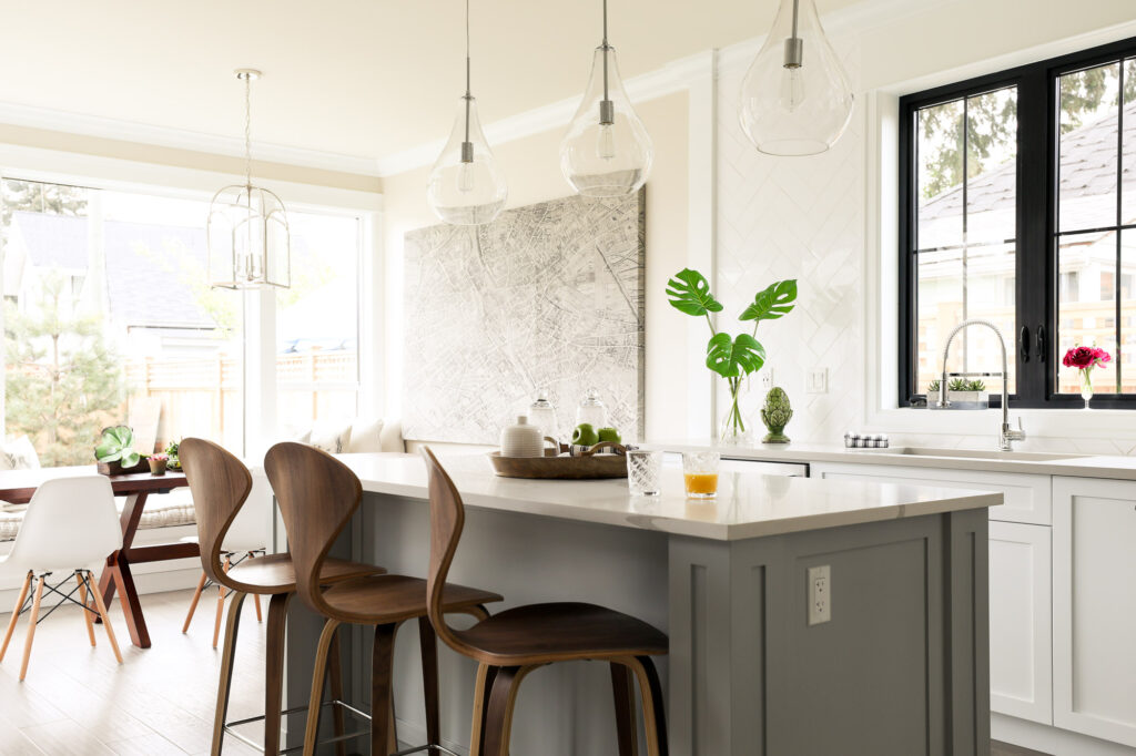 bespoke kitchen design, shaker style kitchen cabinets, spacious kitchen island, polished quartz countertops, statement pendants light the island, Maxine Whitehead Design