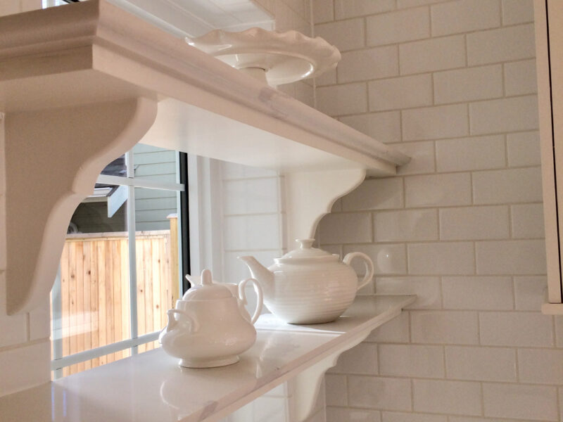 bespoke kitchen design, timeless white kitchen style, classic white kitchen, polished quartz kitchen shelves, glazed finish tile backsplash, Maxine Whitehead Design