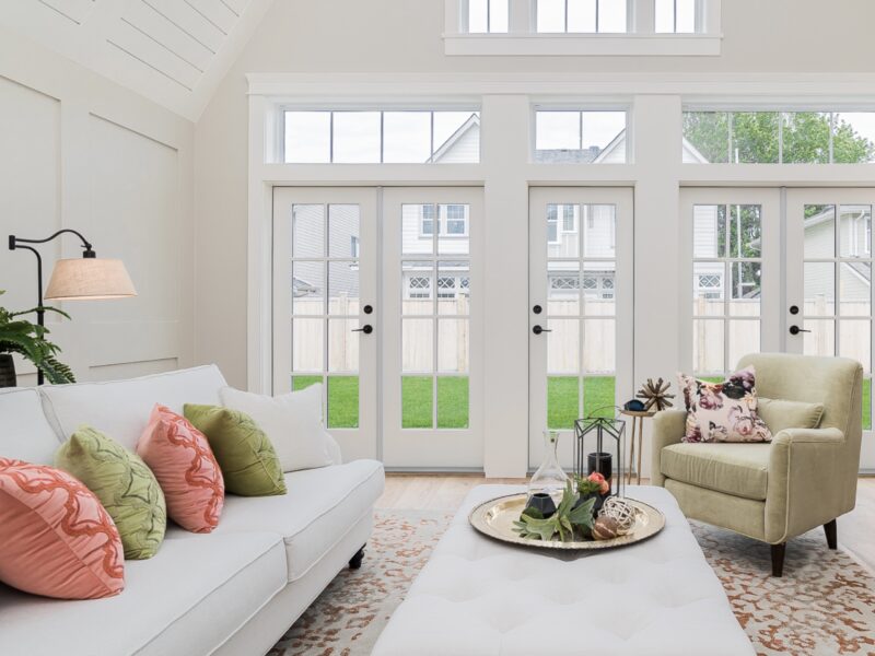 vaulted ceiling, spacious great room, soaring ceiling, inviting paint palette, clerestory windows, roll arm sofa, french doors, Maxine Whitehead design