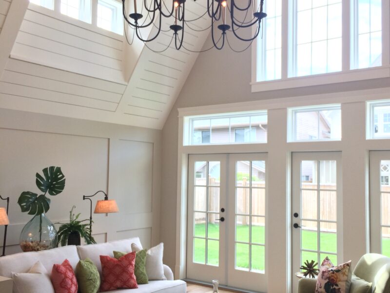 vaulted ceiling, grand chandelier, ship lap detail, spacious great room, soaring ceiling, inviting paint palette, clerestory windows, white sofa, Maxine Whitehead design