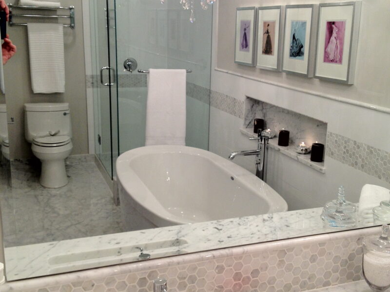 luxurious bathroom, elegant en-suite bathroom, soothing grey accents, large walk-in modern shower, free standing soaker tub, carrara marble counter top, hex mosaic tiles, Maxine Whitehead design