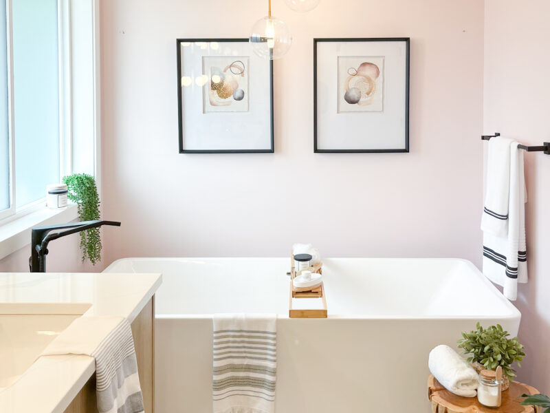 bespoke bathroom design, white oak wood vanity cabinet, double sinks, polished quartz countertop, elegant wall sconces, soaker tub, freestanding tub, hexagon tile, Maxine Whitehead Design