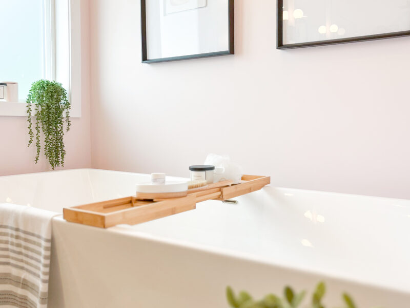 bespoke bathroom design, white oak wood vanity cabinet, double sinks, polished quartz countertop, elegant wall sconces, soaker tub, freestanding tub, hexagon tile, Maxine Whitehead Design